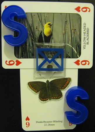 Sixes of hearts featuring a yellow-headed blackbird, a dunkelbrauner bläuling, and some blue letters